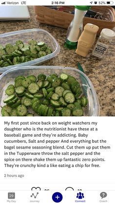 two plastic containers filled with cucumbers sitting on top of a counter