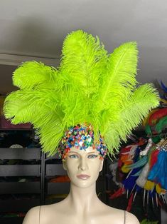 We make and ship our items really fast if you need it for a specific date please let us know.  Premium Ostrich feathers Headdress  Made in USA or call/text us at 954-3051817 to complete your order over the phone NEW STYLE  Collection Tiara Crown Clear Crystal   Headdress Carnival Headdress Mardi Gras  New Orleans Mardi Grass Parade Vegas Show Hora Loca If you are ordering 3 or more pieces from my store at one time, please send me a message and I will be able to give you combined shipping.  New Carnival   made with  Ostrich Floss feather wide  (feathers and crown) approximately* Secures firmly with a 1" glitter elastic band extremely light and easy to wear Ostrich Feathers are a natural product, each one is different and some variance, in color, length and texture should be expected. The fe Party Headpieces With Ostrich Feather Trim, Festival Ostrich Feather Trim Headpiece, Festival Headpiece With Ostrich Feather Trim, Carnival Party Headpiece With Feathers, Ostrich Feather Trim Headpieces For Festivals, Costume Party Hats With Ostrich Feathers, Costume Party Hat With Ostrich Feather Trim, Mardi Gras Costume Hat With Feathers, Feathered Costume Hats And Headpieces For Mardi Gras