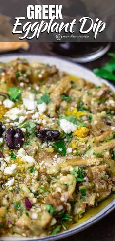 an eggplant dip with olives, feta cheese and parsley on top