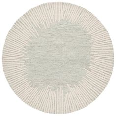 a round rug with white and grey stripes on the center, in front of a white background