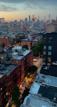 the city skyline is lit up at night from an apartment building in new york's upper east side