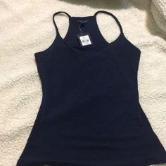 Brand New Navy Blue Tank Top, Perfect For Work. Material: 95% Polyester; 5% Spandex Casual Blue Elastane Tank Top, Blue Seamless Elastane Tops, Blue Elastane Tank Top, Navy Stretch Trendy Top, Trendy Navy Stretch Top, Trendy Stretch Navy Top, Trendy Fitted Navy Tops, Fitted Navy Tank Top For Spring, Navy Fitted Sleeveless Top