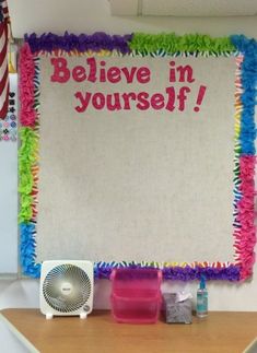 a bulletin board with the words believe in yourself written on it and other decorations around it