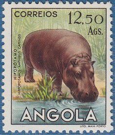 a stamp with an image of a hippopotamus drinking water from a pond