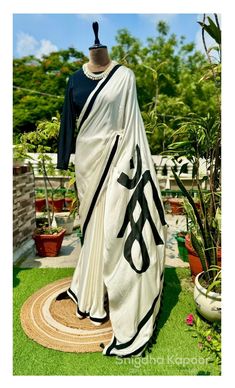 Off white saree with black border and hand painted maa on it paired with a black stitched blouse/ indian designer wedding sari/ casual saree by LabelSnigdhaKapoor on Etsy Off White Saree, Saree Painting, Crepe Saree, White Saree, Black Saree, Casual Saree, Satin Blouse