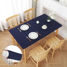 the table is set with two place settings and four wooden chairs, along with an empty plate