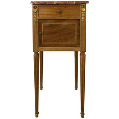 an antique wooden cabinet with marble top and legs, on display against a white background