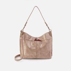 This bag pairs style and function effortlessly, converting from a shoulder bag to crossbody for two looks in one. Antique Brass Hardware, Metallic Leather, Beige Color, Pebbled Leather, Antique Brass, Zip Pockets, Shoulder Bag, Leather