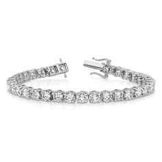 Rhodium over 14K white gold tennis bracelet with prong set 11.01 cttw lab grown diamonds and polished finish. Measures approximately 7"L x 3/16"W and has a box catch clasp. Lab grown diamonds are of VS/SI clarity and G-H color grade. Modern White Tennis Bracelet With Prong Setting, White Platinum Tennis Bracelet With Brilliant Cut, Luxury Lab Grown Diamond Tennis Bracelet With Prong Setting, White Gold Tennis Bracelet With Lab Grown Diamonds, Modern Diamond White Platinum Tennis Bracelet, White Gold Lab-grown Diamond Tennis Bracelet With Prong Setting, White Gold Lab Grown Diamond Tennis Bracelet, White Gold Tennis Bracelet With Lab-grown Diamonds, White Gold Platinum Tennis Bracelet