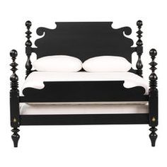 a black and white bed with two pillows on top of the headboard, in front of a white background