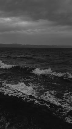 a black and white photo of the ocean