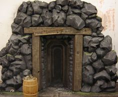 an old fireplace made out of rocks and wood