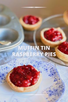 muffin tin raspberry pies on a blue and white plate with the text muffin tin raspberry pies