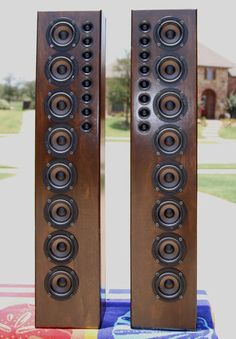 two very large speakers sitting next to each other