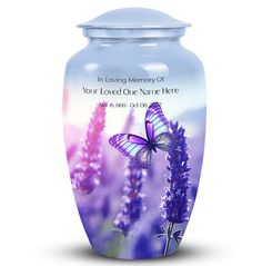 a memorial urn with a butterfly on it and lavender flowers in the foreground