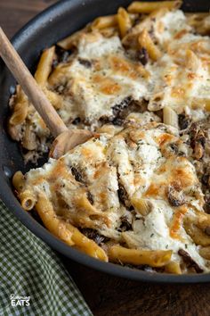 a skillet filled with pasta and cheese