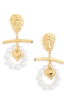 A molten-textured stud anchors a charming heart drop encircled by elegant faux pearls, adding special-occasion sparkle to your look. 1" drop Post back Goldtone plate/glass faux pearl Imported Ugg Style, Moisturizing Toner, Stocking Stuffers For Kids, Pearl Heart, Concert Looks, Heart Drop Earrings, Winter Essentials, Anchors, Mac Cosmetics