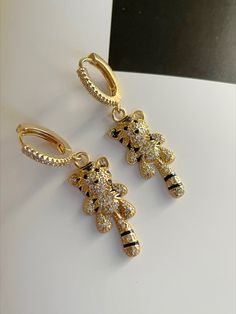 • zirconia • gold plated • tiger • earrings Trendy Cubic Zirconia Drop Earrings, Trendy Dangle Cubic Zirconia Earrings, Trendy Cubic Zirconia Dangle Earrings, Handmade Gold Cubic Zirconia Earrings, Trendy Yellow Gold Cubic Zirconia Earrings, Tiger Earrings, Cute Tiger, Cute Tigers, Gold Plate