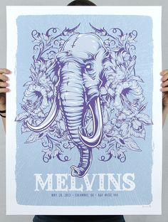 a person holding up a poster with an elephant on it's face and the words melvins