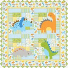 a baby quilt with dinosaurs on it