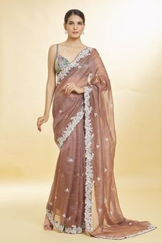 Brown organza saree with all over floral pattern, contrast zari, sequin, kora, and bead hand embroidery.
Components: 1
Pattern: Hand Embroidered
Type Of Work: Sequin, Kora, Zari and Bead Work
Fabric: Organza
Color: Brown
Other Details: 
Cut work hem
Note: The stitched blouse worn by the model is not for sale
Occasion: Wedding,Sangeet - Aza Fashions Brown Organza Saree, Saree Women, Floral Saree, Saree For Women, Organza Saree, Seo Expert, Wearing Clothes, Cut Work, Indian Sarees