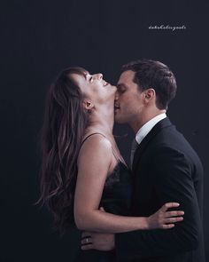 a man and woman kissing each other in front of a black background with the caption's name on it