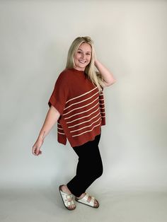 Crafted from a luxurious ribbed fabric, this top combines coziness with style, featuring a high neck that adds a touch of sophistication. The poncho-style design drapes effortlessly, offering a relaxed yet flattering fit for all body types. Available in small, medium, and large Color: Grey, Olive, Rust, with ivory stripes Amy is 5'8" and has a 34b bust. She is wearing a medium. Has an oversized fit, so can size down. Poncho sleeves 50% Viscose, 30% Polyester, 20% Naylon Paired here with our Inar Poncho Style, Lightweight Shorts, Striped Sweater, Equatorial Guinea, British Indian, Ribbed Fabric, Guinea Bissau, Mozambique, Papua New Guinea