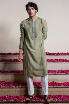 Featuring a green kurta in cotton silk base with mirror embroidery and pintucks detail. Style it with trousers for festive occasions or mehendi ceremonies.#Perniaspopupshopmen #menswear #ethnic #whatiworewastrending #ppuslove #kurtaset #mirrorembroidery #engagment #wedding #weddingwear #festivewear #traditional #sangeet #mehendi House Warming Ceremony, Sangeet Outfit, Mirror Embroidery, Men's Kurta, Green Fits, Wedding Outfits, Kurta Designs