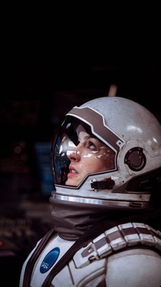 a woman wearing a space suit and helmet