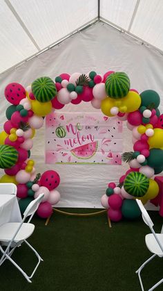 a watermelon themed birthday party with balloons