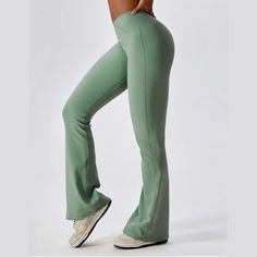 Discover the perfect fusion of style and functionality with these women's high waist flared activewear pants. The high waist design provides excellent tummy control and support, while the elastic waistband ensures a snug yet comfortable fit. The stretchable fabric allows unrestricted movement, making these pants ideal for a range of activities from yoga to dance classes. The flared bottom adds a trendy flair to your gym gear. Stay comfortable, confident, and chic in these versatile activewear pa Green Full Length Yoga Pants With 4-way Stretch, Green Full-length Yoga Pants With 4-way Stretch, Green Full-length 4-way Stretch Yoga Pants, Elastane Gym Pants With Contoured Waistband, Elastane Pants With Contoured Waistband For Gym, Gym Pants With Contoured Waistband, Versatile High Rise Sports Pants, High Rise Four-way Stretch Yoga Pants With Contoured Waistband, High Rise 4-way Stretch Yoga Pants With Contoured Waistband