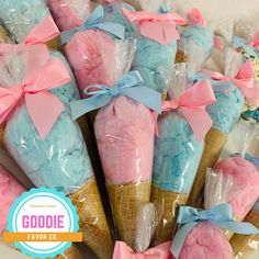 some ice cream cones wrapped in plastic and tied with bows are sitting in a pile