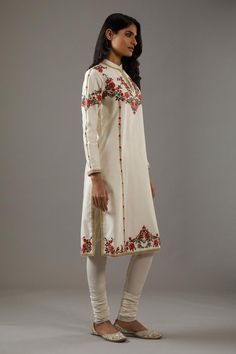 Ivory straight kurta with floral pattern hand embroidery. Comes with churidar and dupatta.
Components: 3
Pattern: Hand Embroidered
Type Of Work: Floral
Neckline: Mandarin
Sleeve Type: Straight Long
Fabric: Chanderi Silk, Cotton, Lining: Cotton
Color: Ivory
Other Details: 
Front potli buttoned collar
Attached lining
Occasion: Puja - Aza Fashions Cream Sets With Floral Embroidery For Transitional Season, Transitional Floral Embroidered Cream Sets, Transitional Cream Sets With Floral Embroidery, Transitional Off-white Sets With Floral Embroidery, Designer White Churidar With Floral Embroidery, Elegant Straight Kurta With Multicolor Embroidery, White Churidar With Floral Embroidery For Designer Wear, White Churidar With Floral Embroidery For Designer Occasions, Cream Embroidered Designer Wear Sets