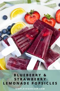 blueberry and strawberry lemonade popsicles on a plate