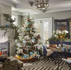 a living room with a christmas tree in the corner