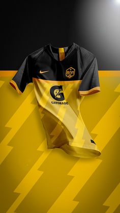 a yellow and black soccer jersey on display