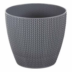 a large gray vase sitting on top of a white table next to a black cup