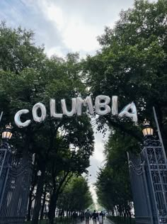 the entrance to columbia university in washington, d c is seen through an iron gate