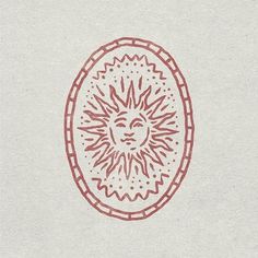 a drawing of a sun in the middle of a circle with red lines on it