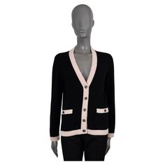 100% authentic Chanel cardigan in black cashmere (100%). Features a V-neck, with contrasting pink speckled cream rib-knit trims and two buttoned pockets at the waist. Closes with rhinestone encrusted metal logo buttons. Unlined. Has been worn and is in excellent condition. 2020 Spring/Summer Measurements Model 20S P64359 K60197 N7070 Tag Size 38 Size S Shoulder Width 41cm (16in) Bust From 94cm (36.7in) Waist From 92cm (35.9in) Hips From 92cm (35.9in) Length 59cm (23in) Side Seam Length 37cm (14.4in) Sleeve Length 60cm (23.4in) All our listings include only the listed item unless otherwise specified in the description above Designer Wool V-neck Outerwear, Classic Black Cashmere Cardigan, Luxury Black Cardigan With Buttons, Luxury Black Sweater With Button Closure, Designer V-neck Cardigan With Button Closure, Fitted V-neck Luxury Cardigan, Designer Black Cardigan With Button Closure, Luxury Wool V-neck Outerwear, Designer V-neck Sweater For Work