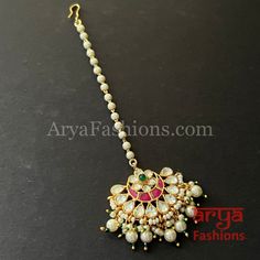 Bridal Rajwadi Kundan Mang Tika with Pearls Mang Tika: Approx. 5 Inches Hook feature to tie the mang tika to hair Made in Brass with golden finish and high quality Kundan stones Lightweight Jewelry Suitable for any occasion and traditional or Modern attire Ready to ship and available for local pickup from 23059. Please message us for more details Free shipping on orders above $75 within USA. Adjustable Kundan Necklace For Puja In Temple Jewelry Style, Traditional Adjustable Kundan Necklace For Puja, Traditional Adjustable Kundan Necklace With Stone Work, Traditional Adjustable Kundan Necklace With Tilla, Adjustable Traditional Kundan Necklace With Stone Work, Adjustable Kundan Necklace With Tilla For Festivals, Adjustable Temple Jewelry Tikka With Stone Work, Traditional Adjustable Meenakari Tikka, Traditional Meenakari Tikka With Adjustable Fit