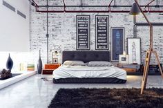 an industrial bedroom with exposed brick walls