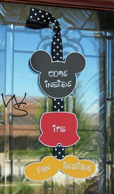 mickey mouse door hanger in front of a window