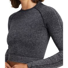 Upgrade Your Activewear Collection With This Stylish Fabletics Ombr Seamless Long Sleeve Crop Top In Black And Grey. This Top Features A Crew Neckline, Long Sleeves, And A Pullover Closure That Makes It Easy To Wear. Its Blended Fabric Fabric Type And Medium Fabric Wash Make It Perfect For An Active Lifestyle. The Top Is Of Size Medium And Has An Athletic Fit. Its Type Is Fitted And Has A Cropped Style, Making It A Versatile Piece That Can Be Worn For Both Workouts And Casual Outings. With Its O Versatile Stretch Gray Activewear, Versatile Gray Stretch Activewear, Stretch Gray Tops For Pilates, Versatile Gray High Stretch Activewear, Casual Seamless Activewear For Pilates, Versatile Gray Compression Activewear, Compressive Seamless Gray Activewear, Compressive Gray Seamless Activewear, Gray Athleisure Tops For Pilates