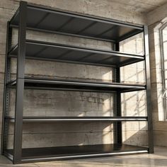 an empty metal shelving unit in a room with concrete walls and flooring on the side