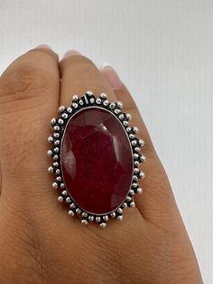 Unusual deep toned raw ruby low content silver setting handmade  size 8.5 Can be resized. My jeweler charges a $20 fee All rings are shipped in a nice gift box.   Check out our over a THOUSAND great reviews Engraving is $4 per letter and is not always perfect depending on the piece. It can take a few days if the jeweler is busy. This is payable to Paypal Judithsltd@gmail.com Spiritual Oval Ruby Ring, Handmade Oval Ruby Ring Gift, Unique Oval Ruby Ring With Stone Setting, Oval Ruby Ring With Large Stone For Gift, Handmade Spiritual Ruby Ring As Gift, Handmade Spiritual Ruby Ring For Gift, Handmade Silver Ruby Ring, Ruby Jewelry With Large Stone For Gift, Unique Oval Ruby Ring