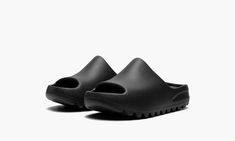 The adidas Yeezy Slide Kids “Onyx” is the kids sizing of the monochromatic black colorway of the popular slip-on sandal by Kanye West.  The “Onyx” was released in March 2022 and is a casual footwear style for the summer and beyond, and a shoe that can easily be worn with anything.  Its lightweight, one-piece EVA foam body is designed in Onyx, or black.  Underneath the sandal, ridges on the outsole provide stability and traction on slippery surfaces.  Release date: March 7, 2022 Adidas Yeezy Slide, Adidas Models, Yeezy Slides, Stadium Goods, Slides Sandals, Slipper Shoes, Adidas Yeezy, Kanye West, Release Date