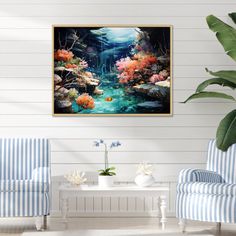 a living room with two chairs and a painting on the wall above it that has an underwater scene