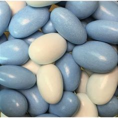 blue and white candy pebbles are piled together