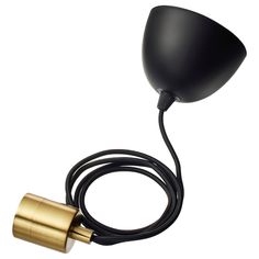 a black and gold lamp with a cord attached to the light bulb, on a white background